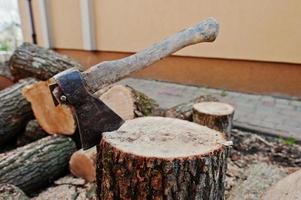 Axe in stump background chopped firewood. photo