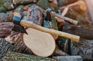 Two axes  in stumps background chopped firewood. photo