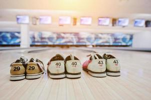 Three pairs of shoes for bowling photo