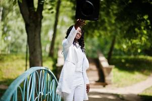 Happy beautiful black african american girl with hat graduates photo