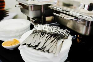 Catering table set for a meal, many fork photo