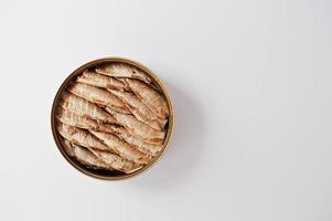 Top view of tin can sprats on white background photo