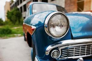 Old vintage car headlight close up. photo