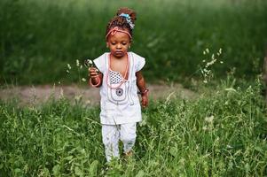 Amazing beautiful african american baby girl with sunglasses having fun photo