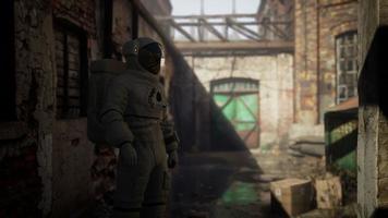 Lost Astronaut near Abandoned Industrial Buildings of Old Factory video