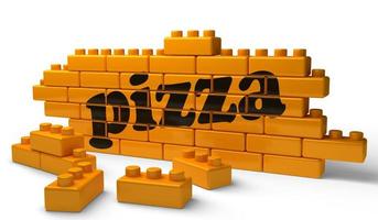 pizza word on yellow brick wall photo