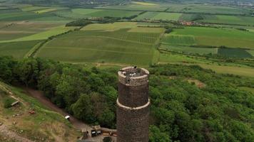 Aerial view of old castle ruins tower - descending shot video