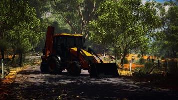 excavator tractor in bush forest video