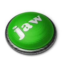 palabra mandíbula en el botón verde aislado en blanco foto