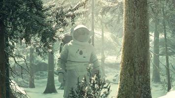 Astronaut exploring forest in snow video