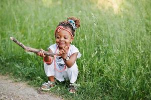 African baby girl walking at park photo