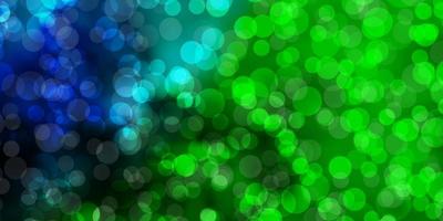 Dark Multicolor vector background with bubbles.