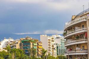 Dark black storm clouds over Greek city panorama Athens Greece. photo