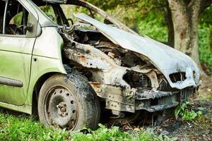 Burned car exterior, vehicle fire due to short circuit, arson, fire damaged motor vehicle, car fire photo