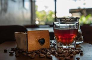 Vintage style coffee grinder with light roasted photo