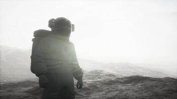 Spaceman walks on the red planet Mars. Space Mission video