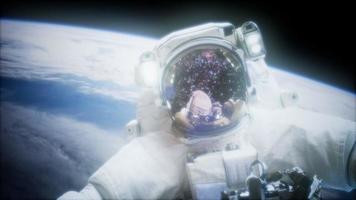 Astronaut at spacewalk. Elements of this image furnished by NASA video