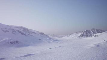 Aerial Landscape of snowy mountains and icy shores in Antarctica video