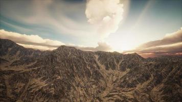 Sun Rays against the Backdrop of the Mountains video