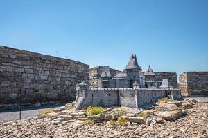 Miniature of castle displayed at museum against blue clear sky photo