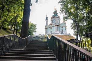 St andrew church on hill with empty steps in foreground against sky photo