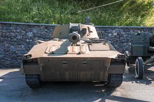 Rusty military tank with barrel displayed at museum of victory park photo