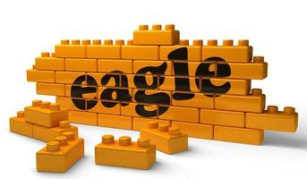 eagle word on yellow brick wall photo