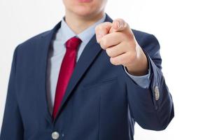 Close up of Business man pointing finger on you isolated on white background. Touching virtual screen. Success concept. Selective focus photo