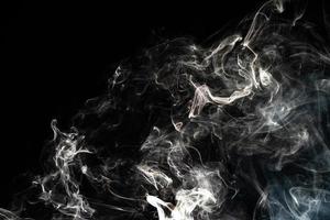 Smoke effect texture. Isolated background. Black and dark backdrop. Smokey fire and mistic effect. photo