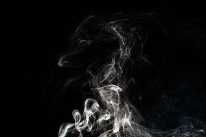 Smoke effect texture. Isolated background. Black and dark backdrop. Smokey fire and mistic effect. photo