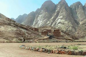 mounting and Bedouins houses in desert in Egypt photo