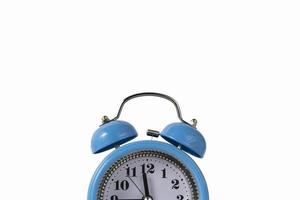 Alarm clock over white. Time concept. Blue alarm clock morning time.
