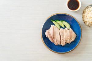 Hainanese chicken rice or rice steamed with chicken soup photo