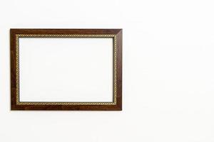 empty picture frame on white wall background photo