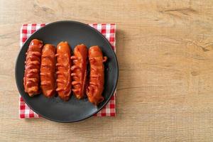 deep fried sausage skewer on plate photo