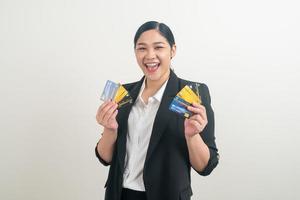 Asian woman holding credit card with white background photo