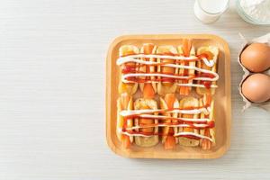 flat pancake roll with sausage and crab stick photo