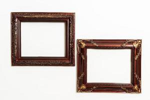 empty picture frame on white wall background photo