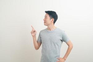 Asian man with hand pointing or presenting on white background photo