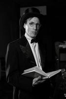 theater actor in a black top hat in the retro atmosphere photo
