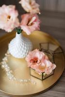 gold wedding rings with a wedding decor photo