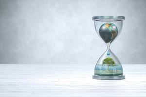 Earth planet in hourglass, Global warming concept. photo