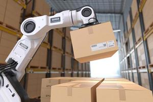The Robot arm picks up the cardboard box in the warehouse, Automation robot arm in the storehouse photo