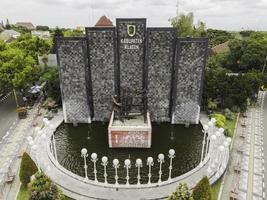 Aerial view of Batik statue in Klaten City with name sign in. Klaten, Indonesia - December 2020 photo