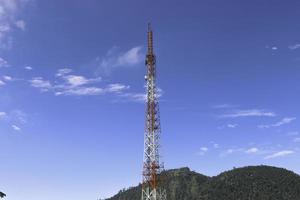 Telecommunication tower mast on sky background. Cellular telephone network or Digital wireless connection system. Receiving station Antenna. photo