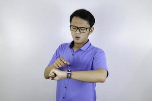 Being late to work and deadline, Young asian man is time delay and late on project. Executive angry, hurry, stress, frustrated and unsatisfied worker man lateness to office. photo