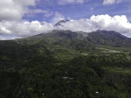 Aerial view of Mount Merapi Landscape with rice field and village in Yogyakarta, Indonesia Volcano Landscape View. photo