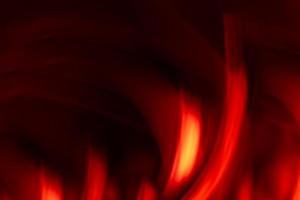 Abstract hot shiny red flame on black background. Backdrop banner. Burning bonfire. photo