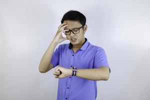 Being late to work and deadline, Young asian man is time delay and late on project. Executive angry, hurry, stress, frustrated and unsatisfied worker man lateness to office. photo