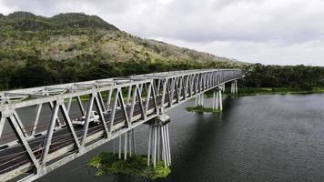 Aerial of long steel bridge in Kretek village, Yogyakarta, Indonesia photo